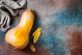 Butternut squash on rustic background. Healthy fall cooking concept.