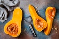 Butternut squash on rustic background. Healthy fall cooking concept.