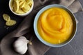 Butternut squash soup with croutons and fresh garlic in ceramic bowl Royalty Free Stock Photo