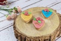 Buttery cookies, decorated with rolling fondant and royal icing. on a wooden trunk board Royalty Free Stock Photo