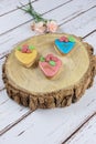 Buttery cookies, decorated with rolling fondant and royal icing. on a wooden trunk board vertical photo Royalty Free Stock Photo