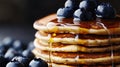 Buttery Pancakes Drizzled with Syrup and Topped with Blueberries Royalty Free Stock Photo