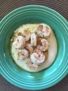 buttery shrimp and grits in vintage teal bowl