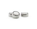 Button cell on isolated background. Small watch lithium battery  Clipping path or cutout object for montage Royalty Free Stock Photo