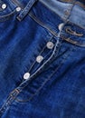 Button closure on the blue jeans Royalty Free Stock Photo