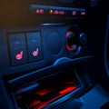 Button on dashboard in modern car panel. Royalty Free Stock Photo