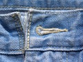Button hole on blue color jeans Royalty Free Stock Photo