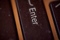 The button of an old laptop. Key Enter. Macro effect photo. Royalty Free Stock Photo