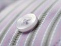 Button on pinstripe shirt macro