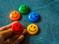 Button of smiley face in different color, happy day choice concept.