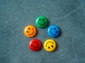 Button of smiley face in different color, happy day choice concept.