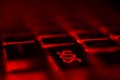 Button sos Laptop keyboard with red backlight. Buttons closeup Royalty Free Stock Photo