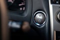 Button start and turn off the ignition of the car engine close-up on the dashboard, electric key, of modern design with elements Royalty Free Stock Photo