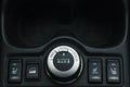 Button switches control for car with soft-focus and over light in the background. 2WD AUTO LOCK BUTTON SWITCH Royalty Free Stock Photo