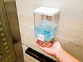 After the button was pressed, a hand sanitizer dispenser was installed in public areas during the COVID-19 outbreak. This one was Royalty Free Stock Photo