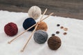 Button and woolen yarn ball on carpet Royalty Free Stock Photo