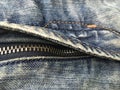 Buttoned zipper on blue boiled shabby retro jeans. Royalty Free Stock Photo