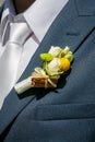 Buttonhole of the groom from beige roses and cinnamon Royalty Free Stock Photo