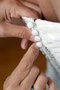 Buttoning up wedding dress Royalty Free Stock Photo