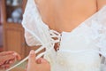 Buttoning wedding dress Royalty Free Stock Photo