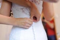 Buttoning Wedding Dress Royalty Free Stock Photo