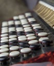 Buttons bayan close-up. Black and white keys of an accordion close up