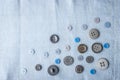 Buttons on the blue cloth top view Royalty Free Stock Photo