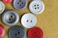 Buttons for clothes background brown fabric. Royalty Free Stock Photo