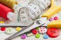 Buttons, colorful fabrics, scissors,measuring tape, spools of thread Royalty Free Stock Photo