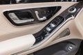 Buttons and elements on the door of a bright interior interior of a luxury Mercedes-Benz S-Class w223.