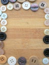 Buttons frame on wooden background