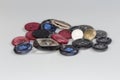 Buttons heap of different design on gray background, selective focus Royalty Free Stock Photo