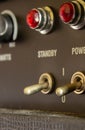 Buttons, knobs and lights of a guitar amplifier Royalty Free Stock Photo