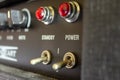 Buttons, knobs and lights of a guitar amplifier Royalty Free Stock Photo