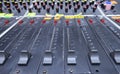 Buttons, levels, switches, speaker volume control on an audio mixer control panel set at the TV studio Royalty Free Stock Photo