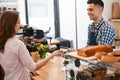 Buy Coffee. Woman Paying With Credit Card In Cafe