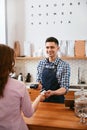 Buy Coffee. Woman Paying With Credit Card In Cafe