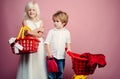 Buy with discount. Girl and boy children shopping. Couple kids hold plastic shopping basket toy. Kids store. Mall Royalty Free Stock Photo