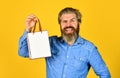 Buy gift. Bearded man hold shopping bags. Retail concept. Happy holidays. Handsome buyer. Seasonal sale. Boost sales