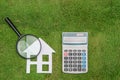 Buy green building house Mortgage calculations, calculator with Royalty Free Stock Photo