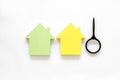 Buy house with house figure and magnifier on office desk white background top view Royalty Free Stock Photo