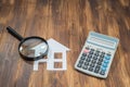 Buy house Mortgage calculations, calculator with Magnifier Royalty Free Stock Photo