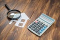 Buy house Mortgage calculations, calculator with Magnifier Royalty Free Stock Photo