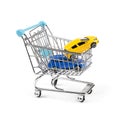 Buy new car concept, two cars in a shopping cart Royalty Free Stock Photo