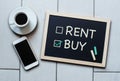 Buy not rent blackboard concept. Choosing buying over renting.