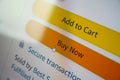 Buy now button on screen. Buying items online on amazon or ebay Royalty Free Stock Photo