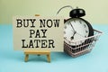 Buy Now Pay Later text message with trolley cart and alarm clock for business and commercial concepts Royalty Free Stock Photo