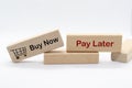 Buy now pay later text on wooden blocks. Business and installment payment concept