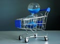 Buy time concept. Shopping cart and hourglass