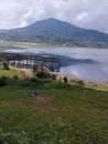 Buyan Lake, Bali Island - Vacation by the lake with a beautiful mountain view when the weather is sunny Royalty Free Stock Photo